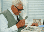 M3400136-Elderly_man_uses_a_magnifying_glass_to_read_paper-SPL[1].png