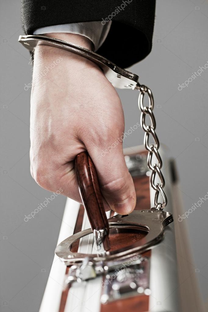 depositphotos_25260455-Case-attached-to-hand-with-handcuffs.jpg